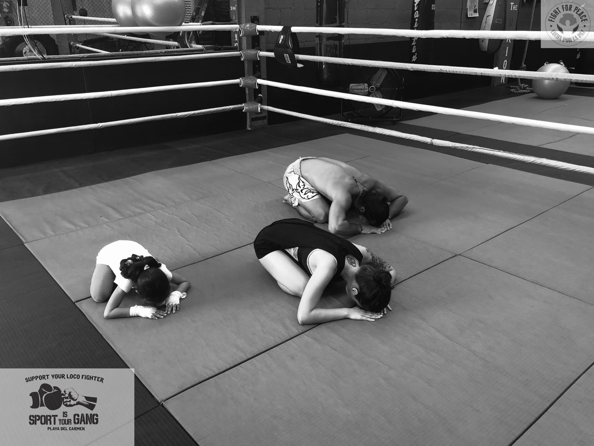 Fighters bowing before training at The Union Gym, demonstrating respect and honor in traditional Muay Thai and Boxing culture