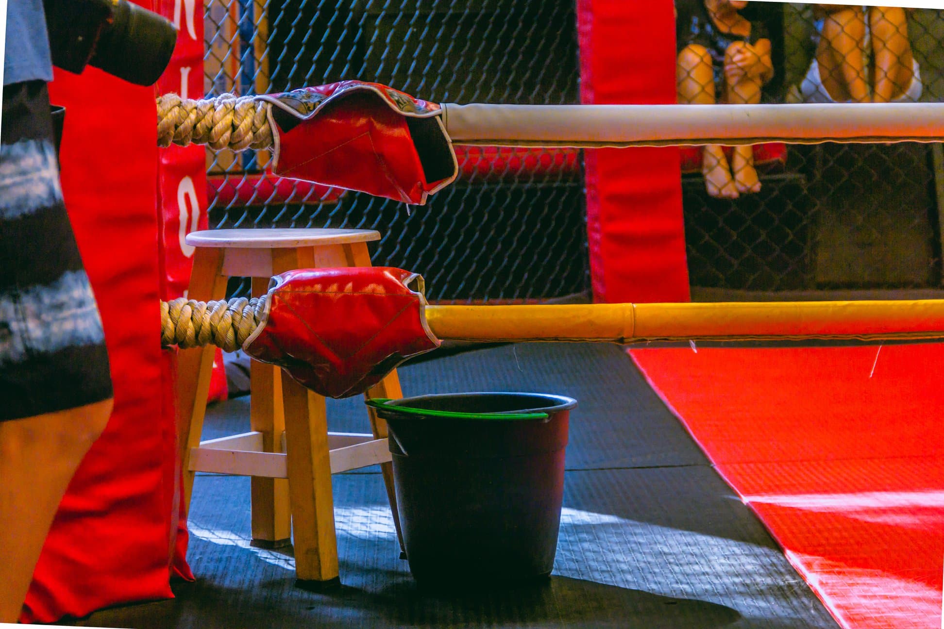 Fighter's corner with boxing stool at The Union Gym ring, displaying the authentic old-school training environment for combat sports