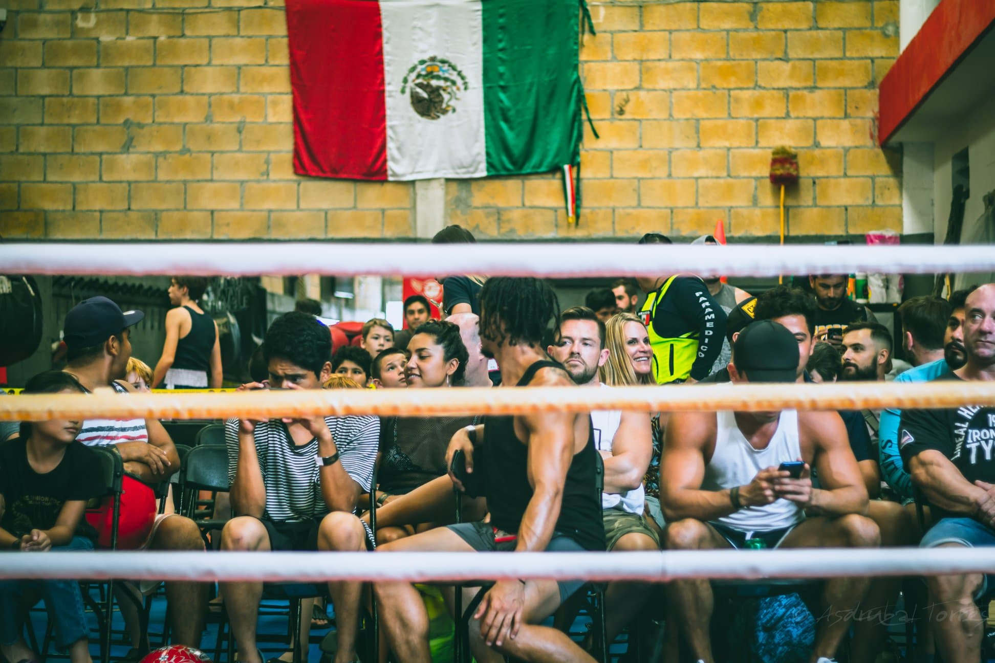 Spectators watching Muay Thai smoker fights at The Union Gym in Playa del Carmen, showcasing authentic fight culture and community engagement at the gym